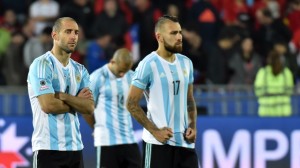 Argentina's defender Pablo Zabaleta (L), Argentina's midfielder Javier Mascherano (C) and Argentina's defender Nicolas Otamendi react in dejection after their 2015 Copa America final football match penalty shootout against Chile, in Santiago, Chile, on July 4, 2015. Chile won by 4-1 (0-0). AFP PHOTO / NELSON ALMEIDA