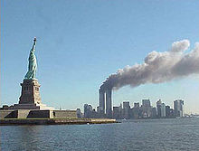 220px-national_park_service_9-11_statue_of_liberty_and_wtc_fire