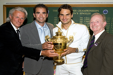 from left to right) Bjorn Borg, Pete Sampras, Roger Federer and Rod Laver pose with the trophy they have all held over the years.