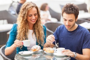 Young Couple Having a Traditional Italian Breakfast